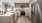 a kitchen with a stainless steel refrigerator