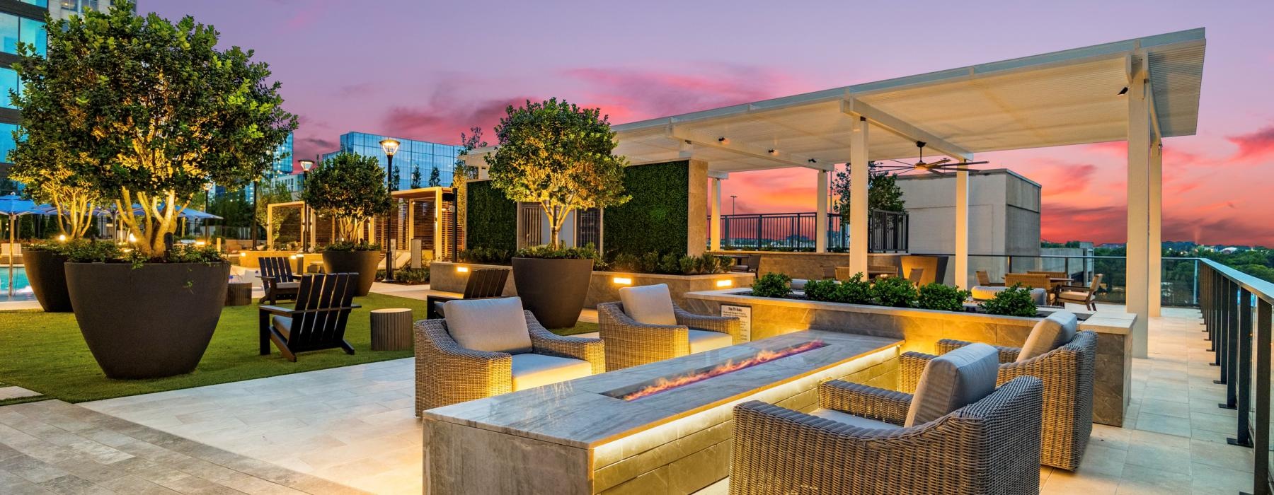 a patio with a pool and chairs