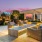 a patio with a pool and chairs